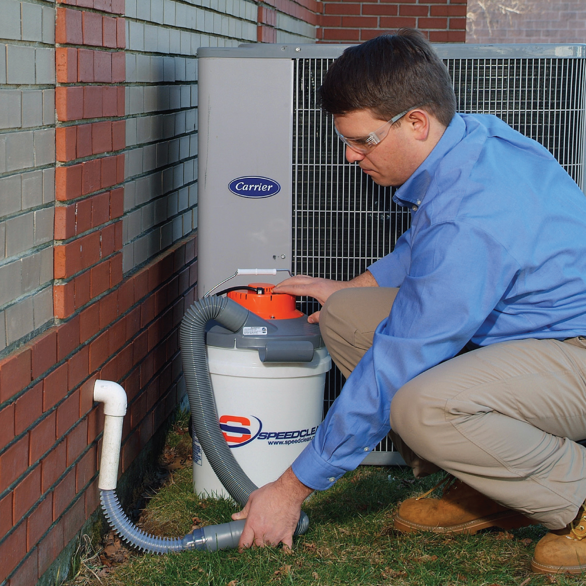 HVAC Tech cleaning hvac drain line